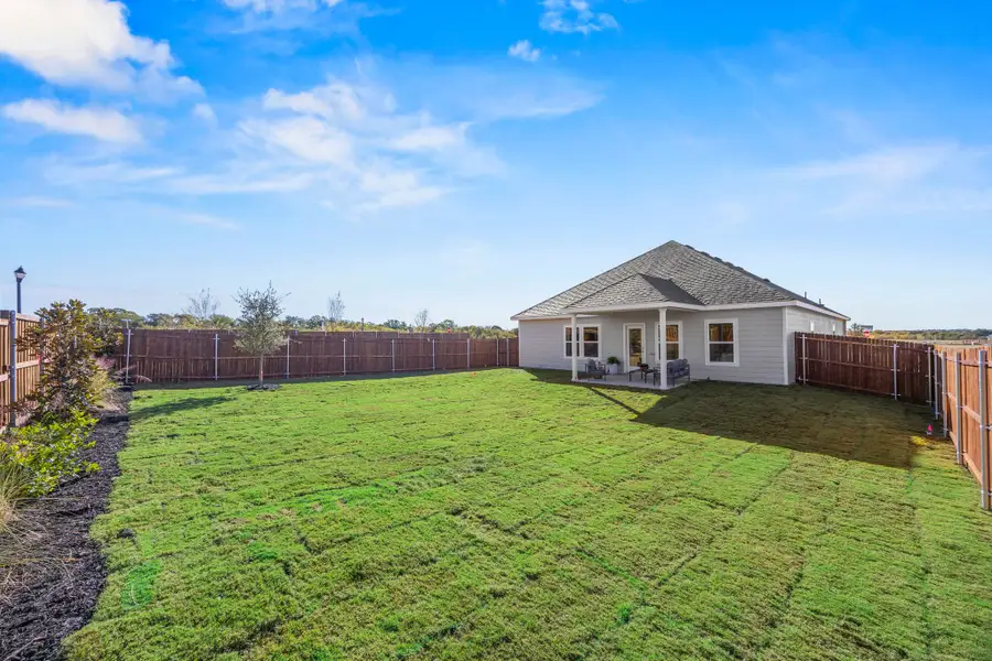 A house with a fence around it.