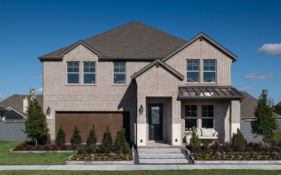 Front exterior of a home in the Union Park 50s community, located in Little Elm, TX (Image 19).