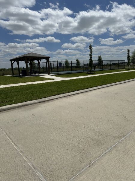 A serene park with a gazebo and sports court at Winfrey Estates by ROC Homes in Tomball, TX. A serene park with a gazebo and sports court at Winfrey Estates by ROC Homes in Tomball, TX.