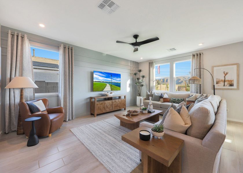 A living room with a large window. A living room with a large window.