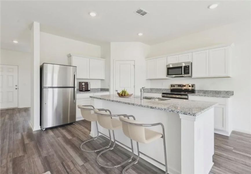 Furnished interior in a model home at Sunterra Lakes in Brookshire (Image 6).