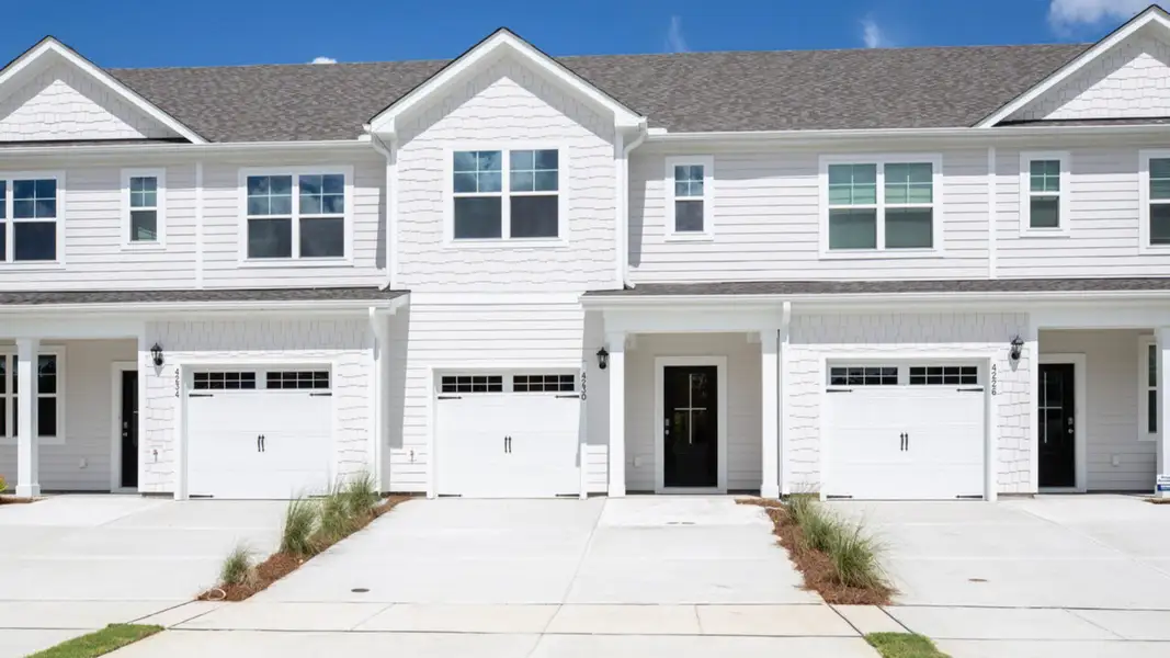Front exterior of a home in the The Palms at Indigo Preserve Townhomes community, located in Leland, NC (Image 4).