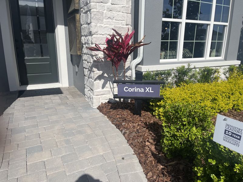 A charming home with stone accents and lush landscaping in Emerson Pointe by M/I Homes (Apopka, FL). A charming home with stone accents and lush landscaping in Emerson Pointe by M/I Homes (Apopka, FL).