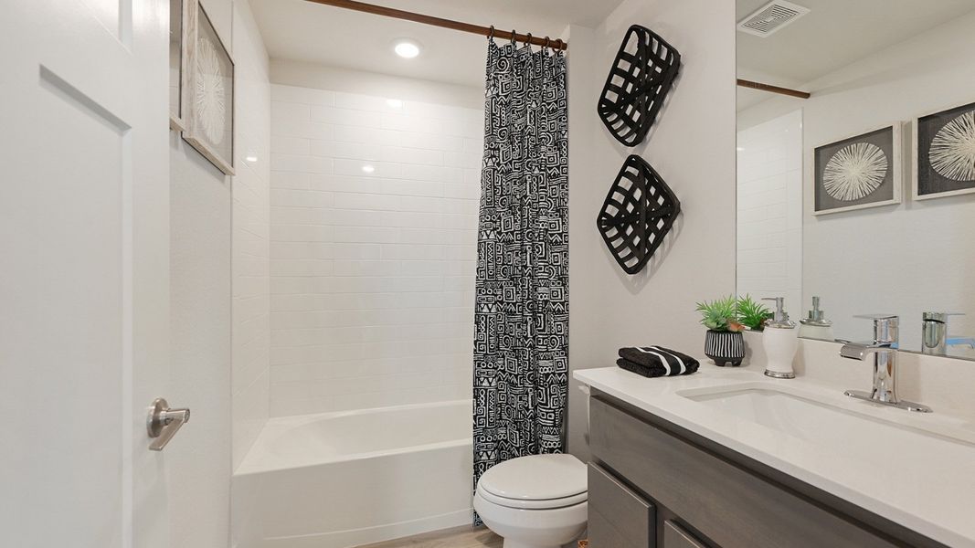 Furnished interior in a model home at Midtown Reserve in College Station (Image 12).