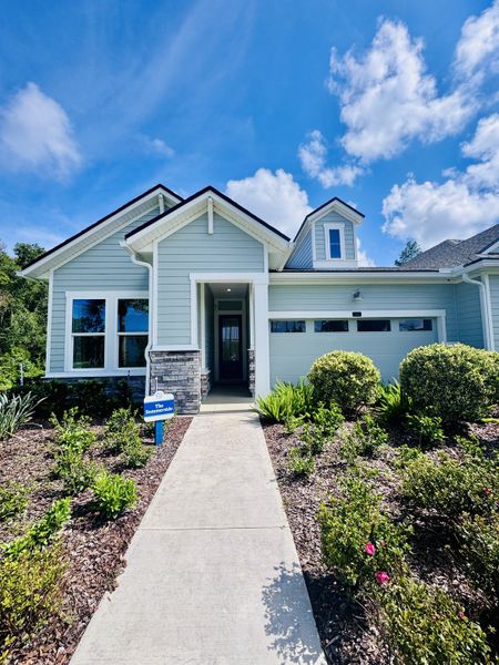 A charming blue home with manicured landscaping in Crosswinds 40' Paired Villas by David Weekley Homes (Ponte Vedra, FL). A charming blue home with manicured landscaping in Crosswinds 40' Paired Villas by David Weekley Homes (Ponte Vedra, FL).