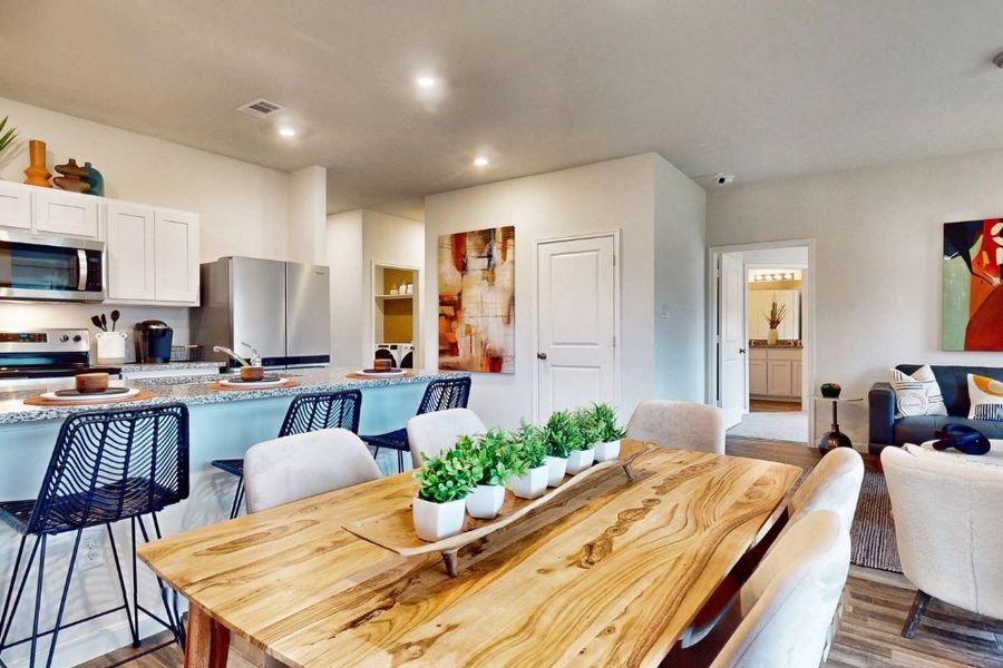 A kitchen with a dining table. A kitchen with a dining table.