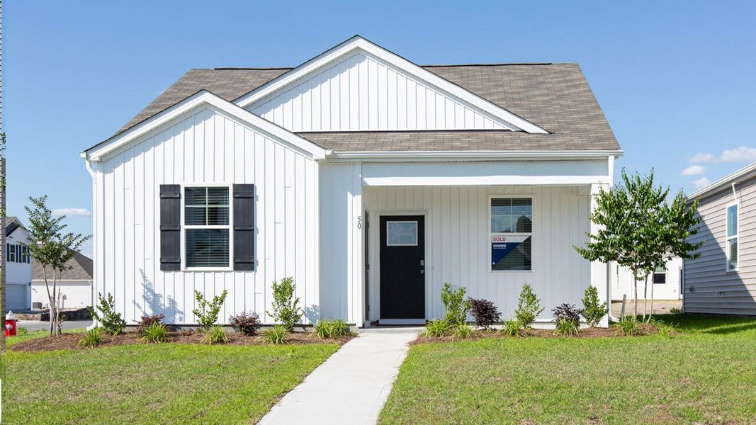 Front exterior of a home in the The Cottages at Blake Farm community, located in Wilmington, NC (Image 5).