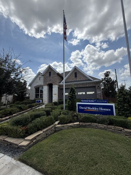 A beautiful brick home with manicured landscaping in Meridiana 55' Homesites by David Weekley Homes (Manvel, TX). A beautiful brick home with manicured landscaping in Meridiana 55' Homesites by David Weekley Homes (Manvel, TX).