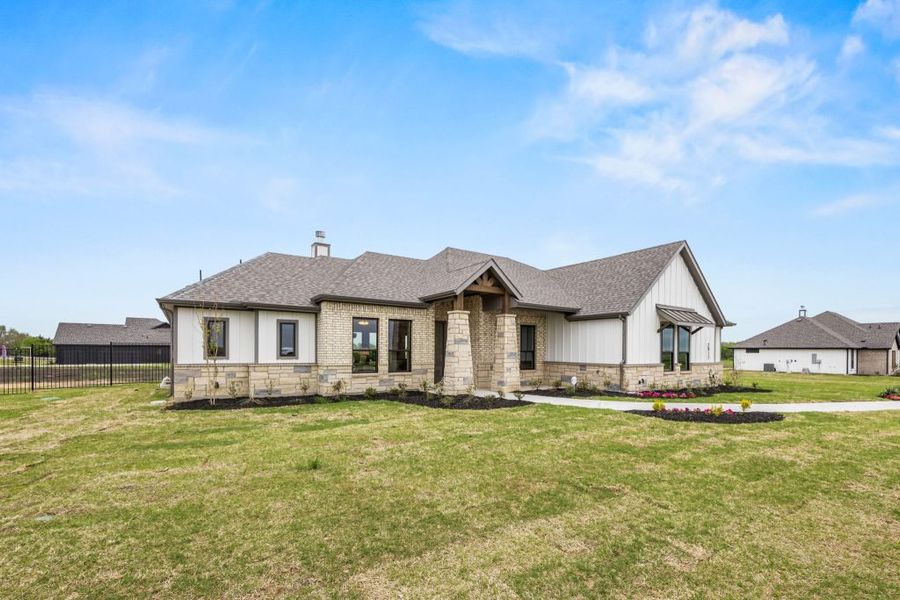 Front exterior of a home in the Carrera Ranch community, located in Waxahachie, TX (Image 2). Front exterior of a home in the Carrera Ranch community, located in Waxahachie, TX (Image 2).