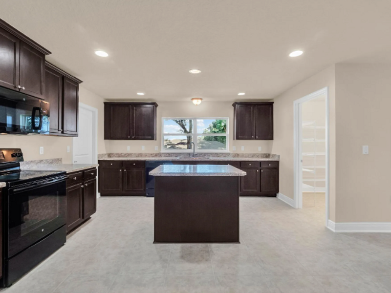 Furnished interior in a model home at Pine Ridge in Beverly Hills (Image 5).