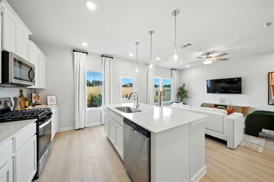 A kitchen with white cabinets. A kitchen with white cabinets.