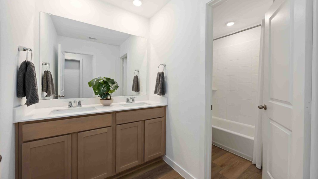 Furnished interior in a model home at Pinehaven in Houston (Image 11).