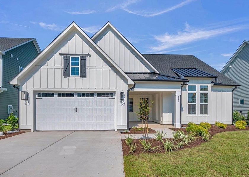 Front exterior of a home in the WyndWater community, located in Hampstead, NC (Image 31).
