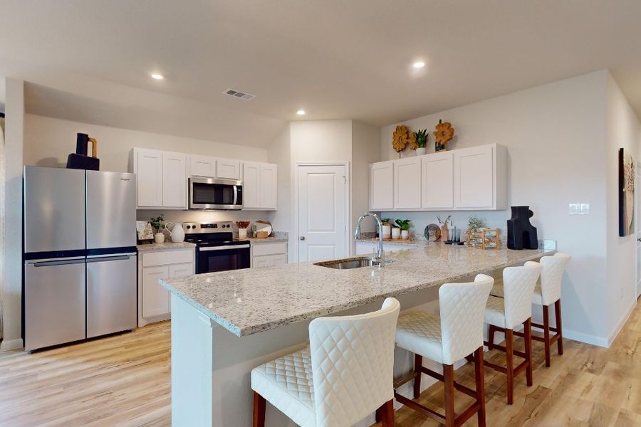 A kitchen with white cabinets. A kitchen with white cabinets.