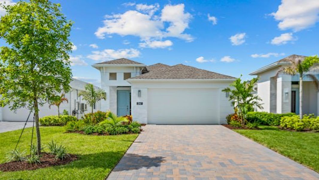 Front exterior of a home in the The Falls at Grand Harbor community, located in Vero Beach, FL (Image 53).