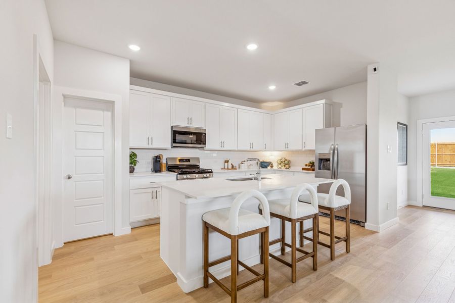 Kitchen in a Terra Vella Hayden Model Home in Fort Worth TX by Trophy Signature Homes