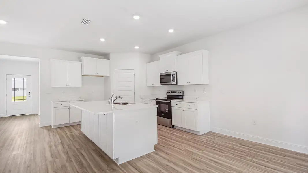 Furnished interior in a model home at Bayside at Ward Creek in Panama City Beach (Image 4).