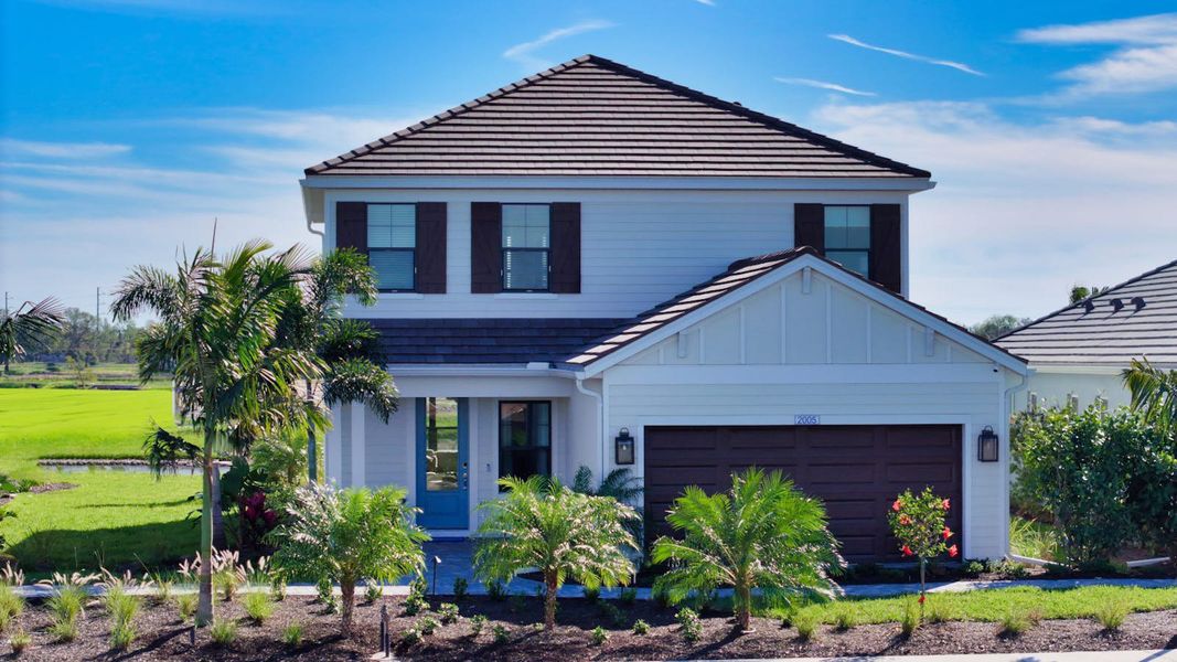 Front exterior of a home in the Palm Grove community, located in Bradenton, FL (Image 5).