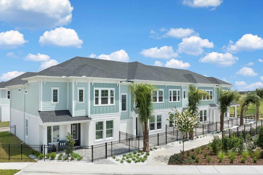 Front exterior of a home in the Persimmon Place - Townhomes community, located in Wesley Chapel, FL (Image 3).