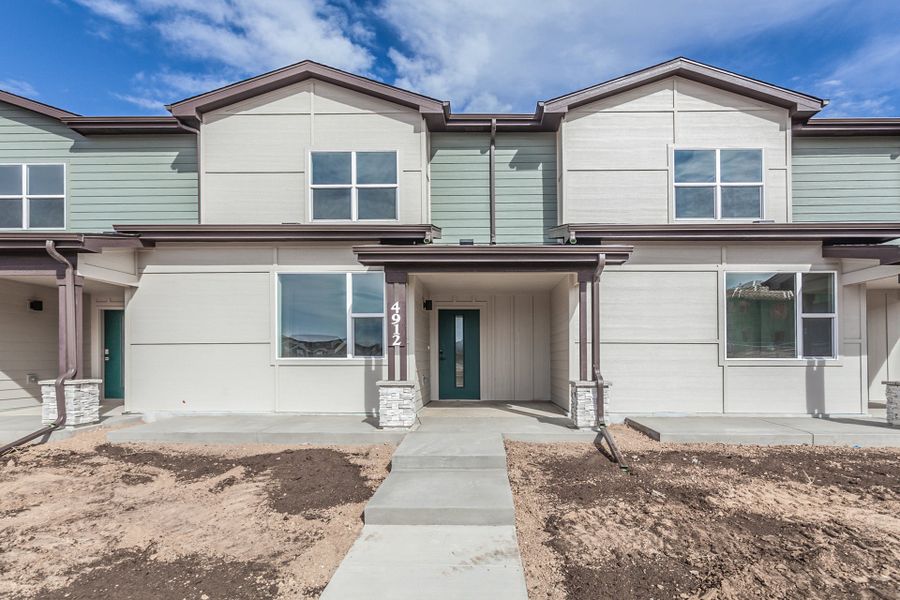 Front exterior of a home in the Timnath Ranch Townhomes community, located in Timnath, CO (Image 3).