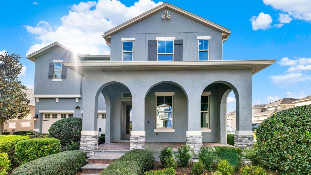 Front exterior of a home in the Waterleigh community, located in Winter Garden, FL (Image 2).
