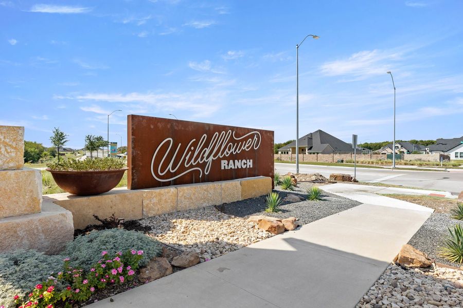Entrance to the Wildflower Ranch community in Fort Worth, TX, featuring signage and landscaping (Image 11).