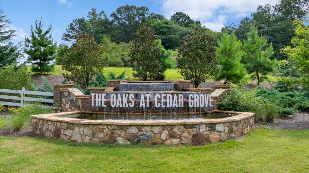 Entrance to the Oaks at Cedar Grove community in Fairburn, GA, featuring signage and landscaping (Image 2). Entrance to the Oaks at Cedar Grove community in Fairburn, GA, featuring signage and landscaping (Image 2).