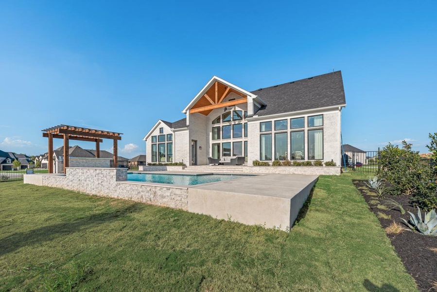 Front exterior of a home in the Heath Golf & Yacht Club community, located in Heath, TX (Image 11). Front exterior of a home in the Heath Golf & Yacht Club community, located in Heath, TX (Image 11).