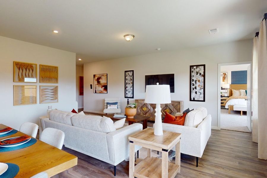 A living room with white couches.