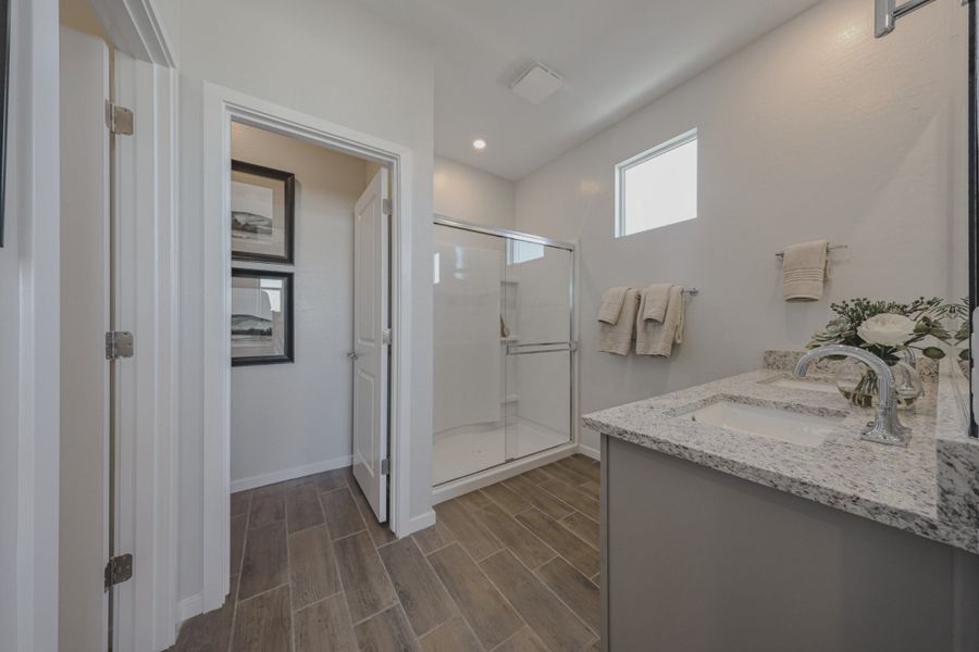 A bathroom with a glass shower.