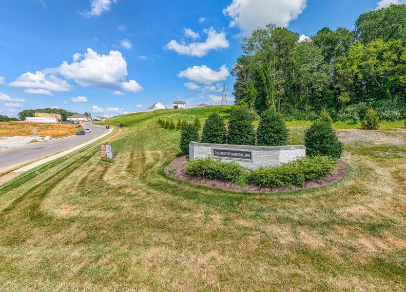 Entrance to the The Grove at Harrison Glen community in Lenoir City, TN, featuring signage and landscaping (Image 2). Entrance to the The Grove at Harrison Glen community in Lenoir City, TN, featuring signage and landscaping (Image 2).