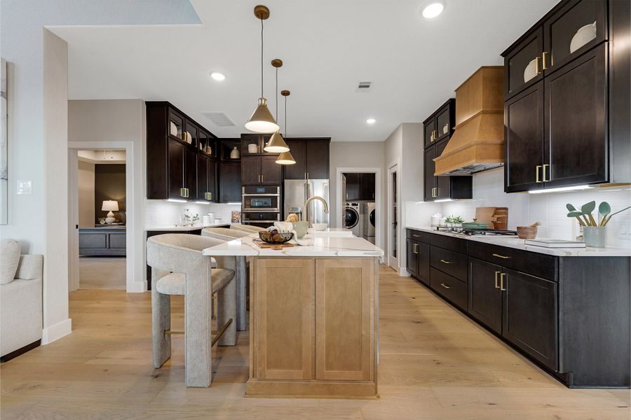 Furnished interior in a model home at Sunterra Lakes in Brookshire (Image 21).