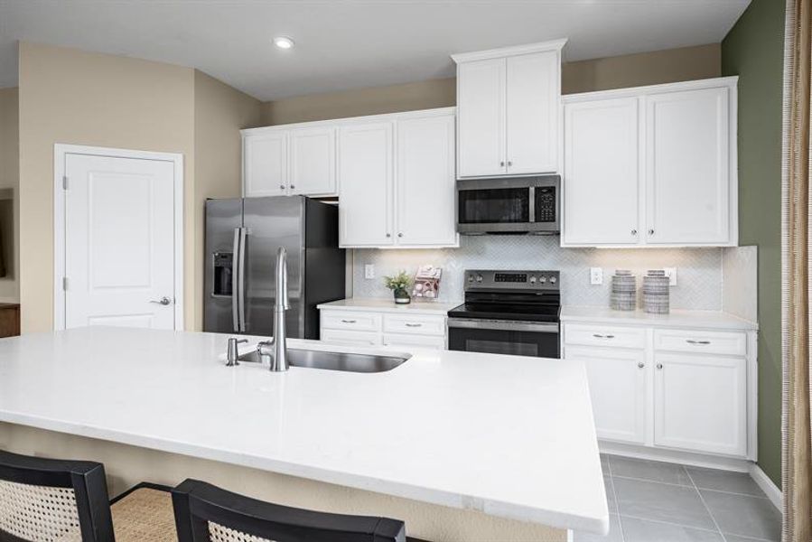 Furnished interior in a model home at Pine Pointe at Astonia in Davenport (Image 7).