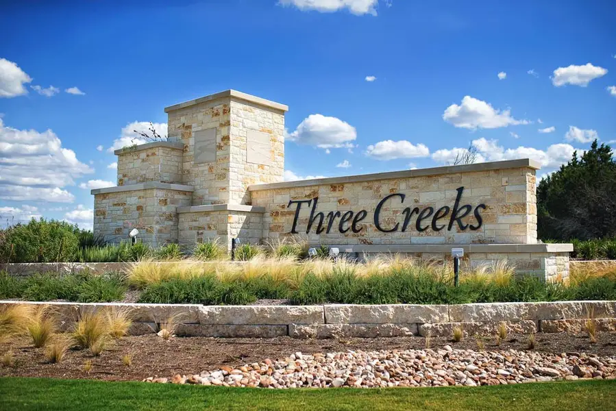Entrance to the Three Creeks - Colt Creek community in Belton, TX, featuring signage and landscaping (Image 1).