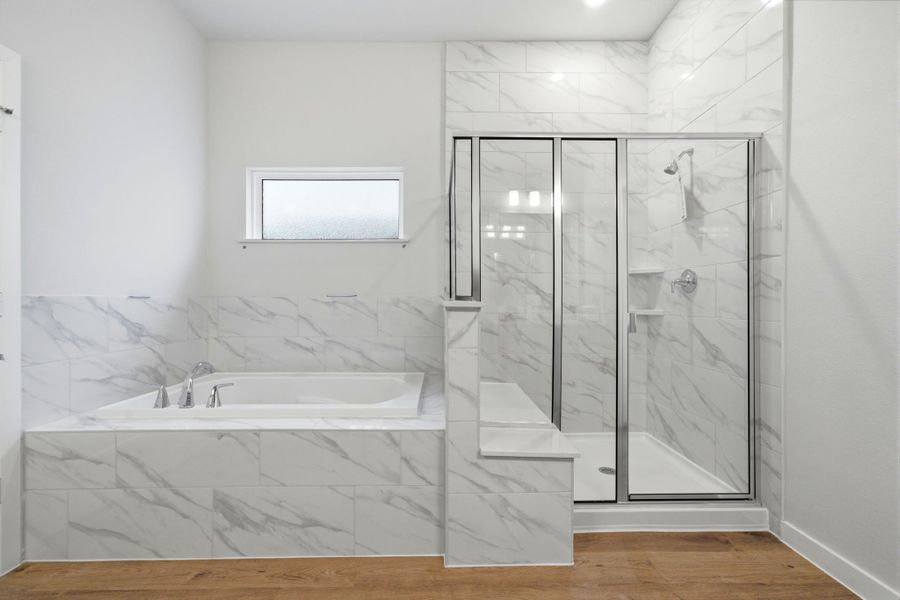 A bathroom with a glass shower. A bathroom with a glass shower.