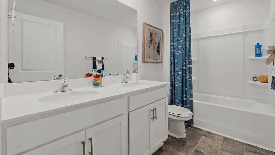 Furnished interior in a model home at Bentley Park in Greenwood (Image 30).