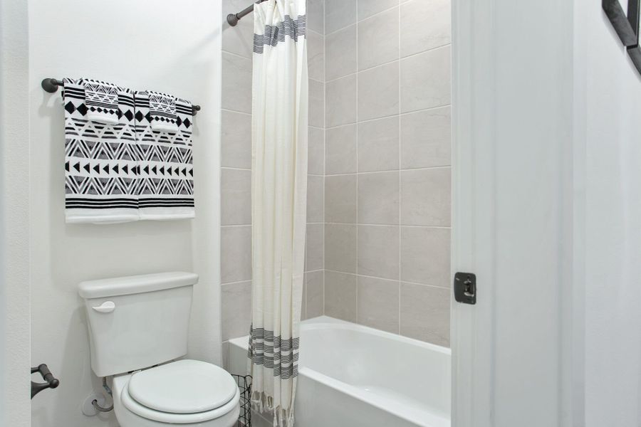 Furnished interior in a model home at Windsong Ranch Townhomes in Prosper (Image 28).