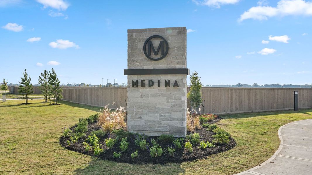 Entrance to the Medina community in Dayton, TX, featuring signage and landscaping (Image 1).