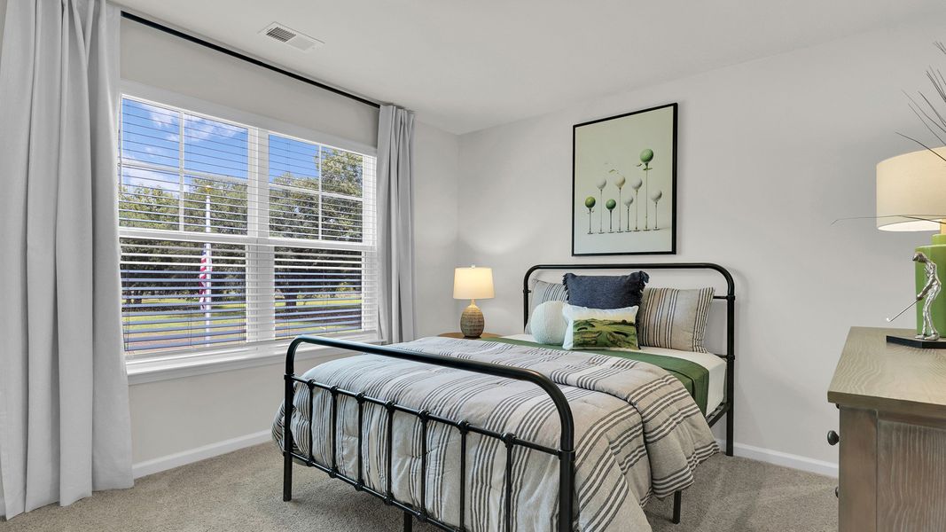 Furnished interior in a model home at The Cove at Mallard Crossing in Summerville (Image 30).