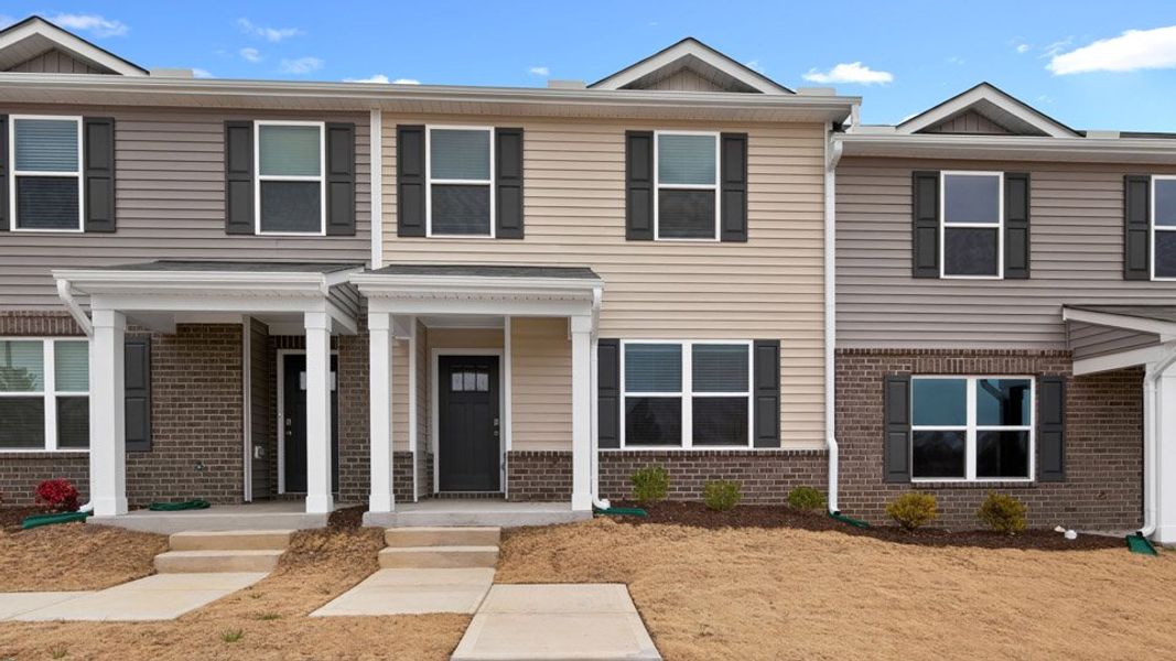 Front exterior of a home in the The Townes at Matthews Landing community, located in Fuquay Varina, NC (Image 12).