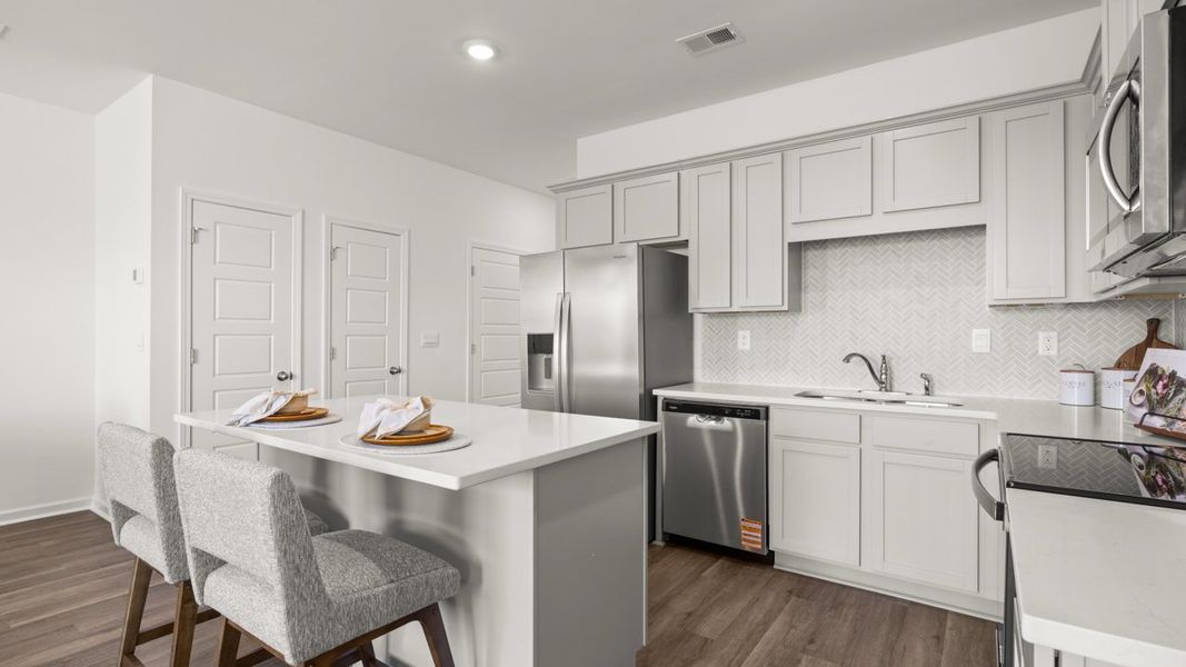 Furnished interior in a model home at The Gables at Agricultural Village in Perry (Image 9).