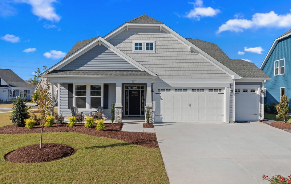 Front exterior of a home in the Traditions at Carolina Forest community, located in Myrtle Beach, SC (Image 27).