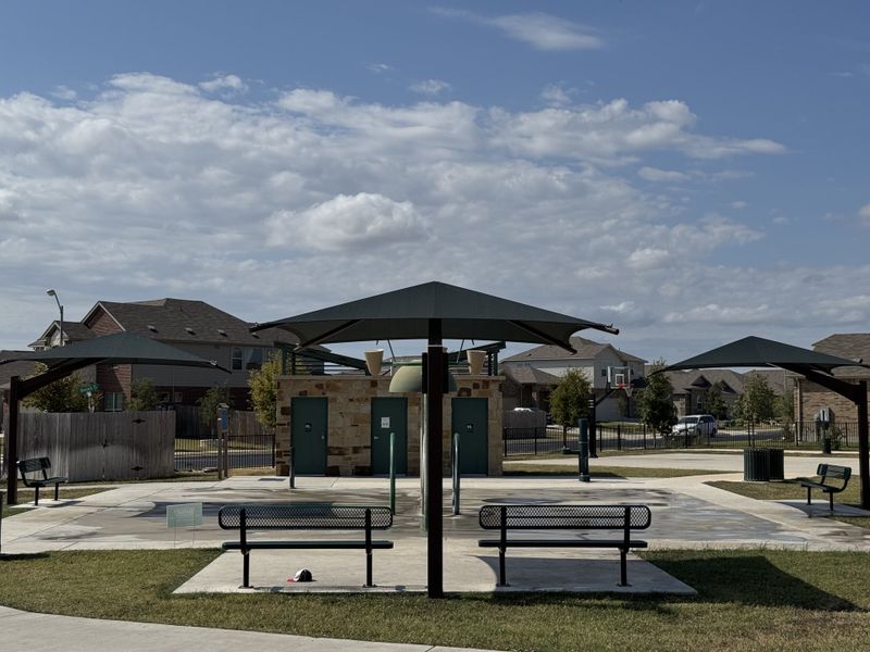 A welcoming park with shaded benches and a scenic setting in Highlands North by Brightland Homes (Hutto, TX). A welcoming park with shaded benches and a scenic setting in Highlands North by Brightland Homes (Hutto, TX).