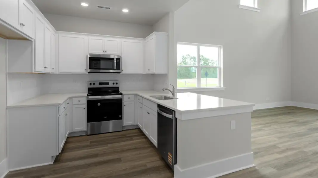 Furnished interior in a model home at Indigo Preserve Townhomes in Leland (Image 5).