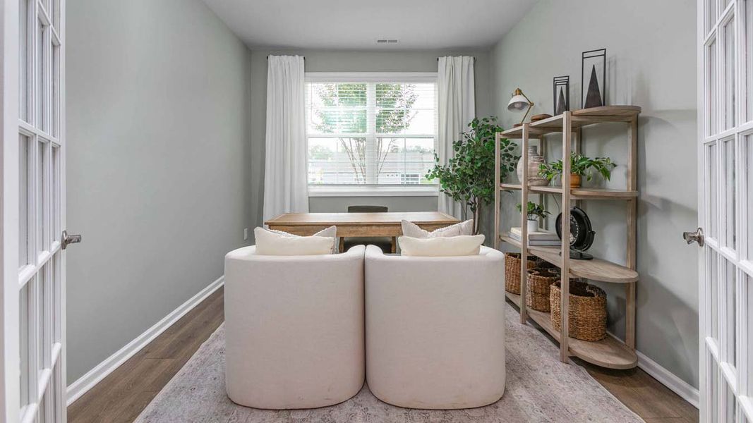 Furnished interior in a model home at Quarry Hills - Freedom in Swepsonville (Image 3).