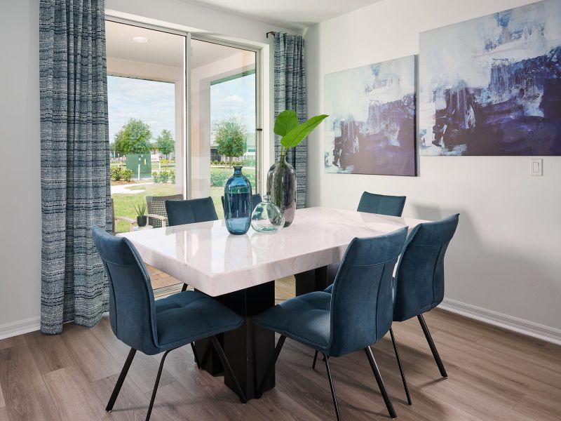 Dining room in the Hibiscus floorplan modeled at The Reserve at Twin Lakes