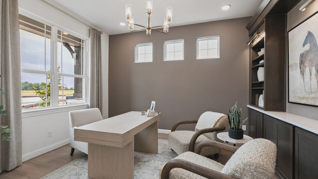 Luxurious study features plush seating, sleek wood accents, and elegant built-ins in Katy Lakes. Luxurious study features plush seating, sleek wood accents, and elegant built-ins in Katy Lakes.