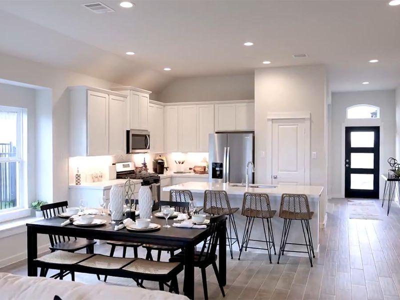 A kitchen with a dining table. A kitchen with a dining table.