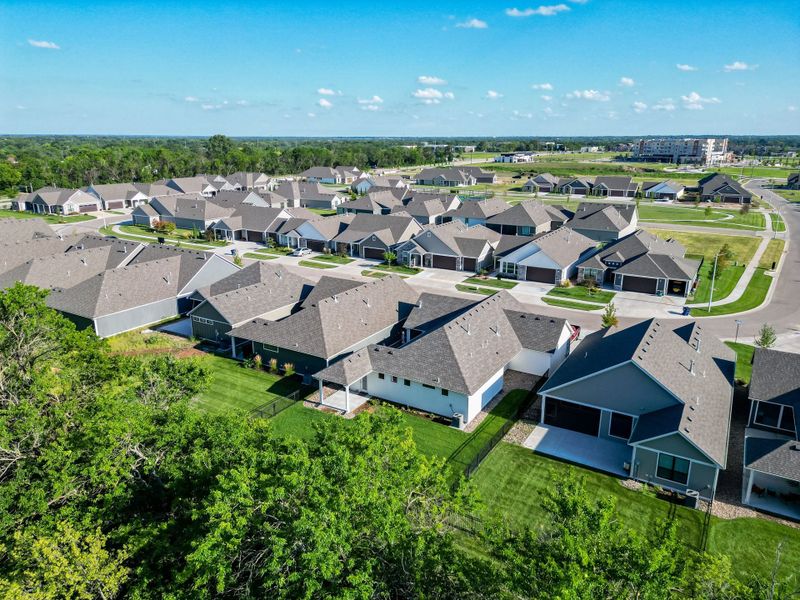 Aerial view of the The Courtyards at The Heritage community in Andover, KS, showing layout and nearby surroundings (Image 22). Aerial view of the The Courtyards at The Heritage community in Andover, KS, showing layout and nearby surroundings (Image 22).