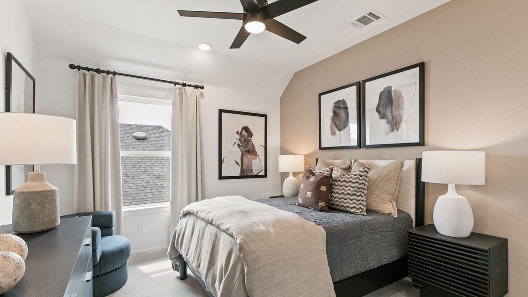 Luxurious bedroom with beige accent wall and plush textiles in Park at Eldridge's exclusive community.